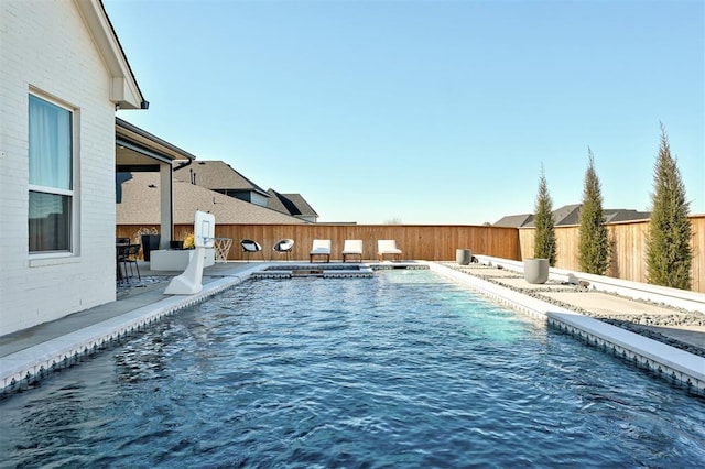 view of swimming pool with a patio