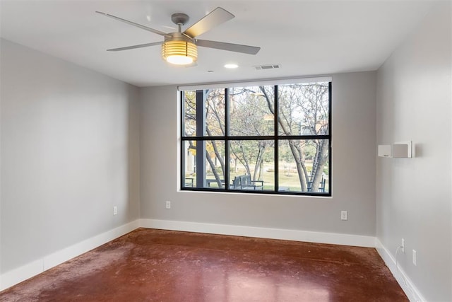 spare room with ceiling fan