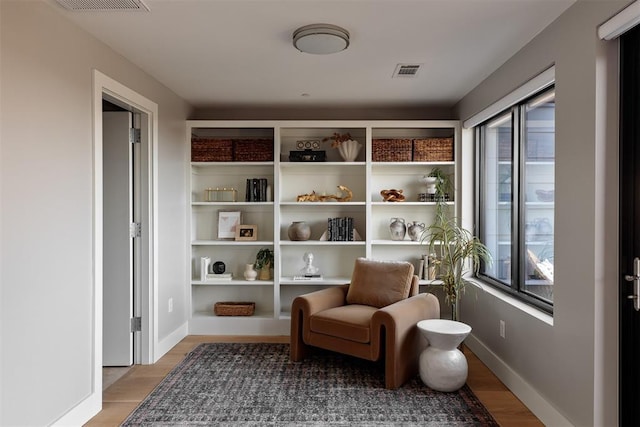 sitting room featuring hardwood / wood-style floors