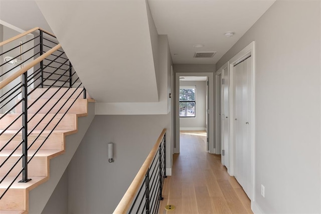 staircase featuring hardwood / wood-style flooring