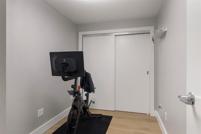 exercise area featuring light hardwood / wood-style floors