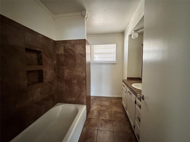 bathroom featuring tile patterned flooring, vanity, and tiled shower / bath combo