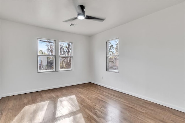 unfurnished room featuring hardwood / wood-style flooring and ceiling fan