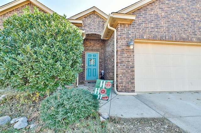 view of exterior entry featuring a garage