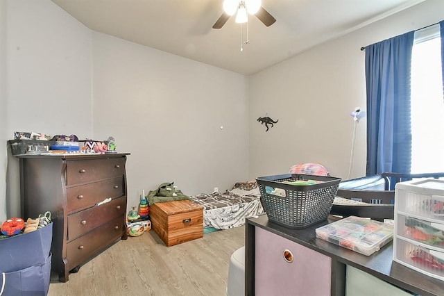 bedroom featuring light wood-type flooring and ceiling fan