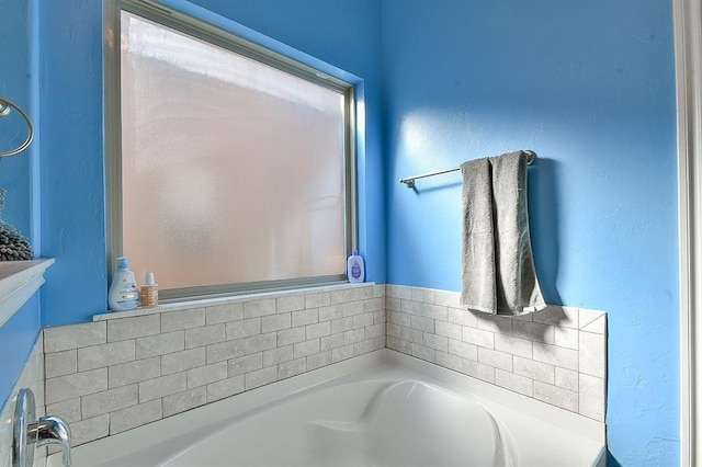 bathroom featuring a washtub