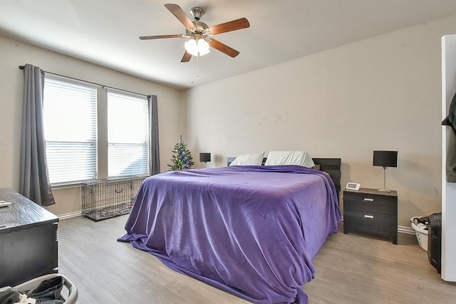 bedroom featuring ceiling fan and light hardwood / wood-style flooring