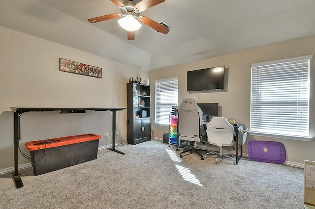 office area featuring ceiling fan, light colored carpet, and vaulted ceiling