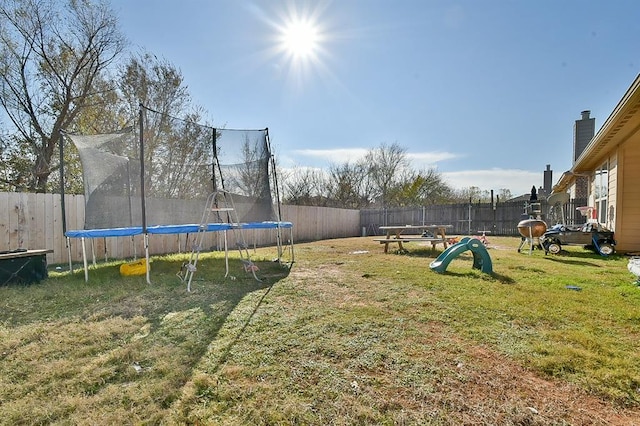 view of yard with a trampoline