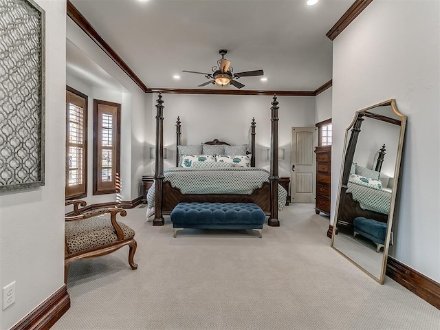 bedroom featuring ceiling fan, carpet floors, and ornamental molding