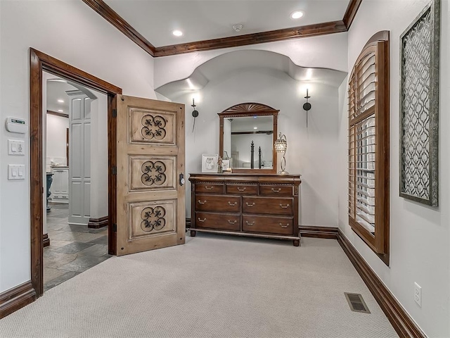 bedroom featuring dark colored carpet and ornamental molding