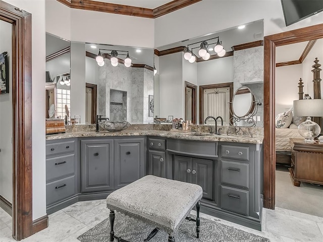 bathroom with vanity and crown molding