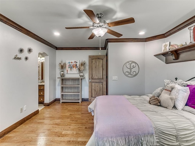 bedroom with ensuite bath, ceiling fan, ornamental molding, and light wood-type flooring