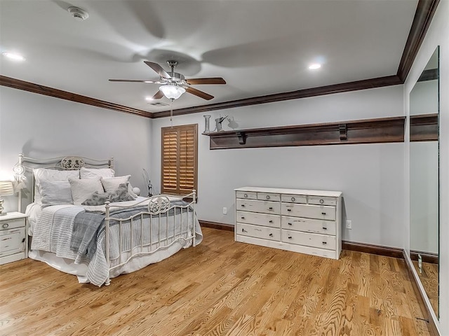 bedroom featuring light hardwood / wood-style flooring, ceiling fan, and ornamental molding