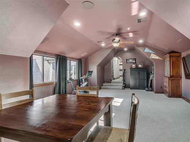 interior space with light colored carpet, vaulted ceiling, and ceiling fan