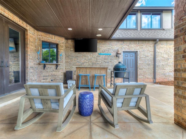 view of patio / terrace featuring an outdoor living space and an outdoor bar