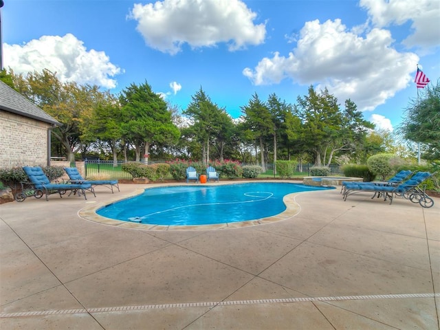 view of swimming pool with a patio area