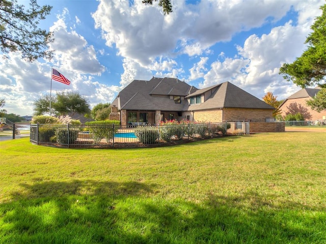 view of yard with a fenced in pool