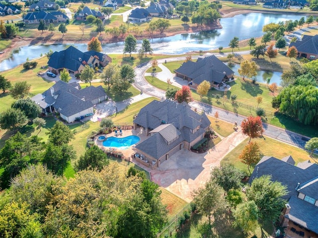 birds eye view of property featuring a water view