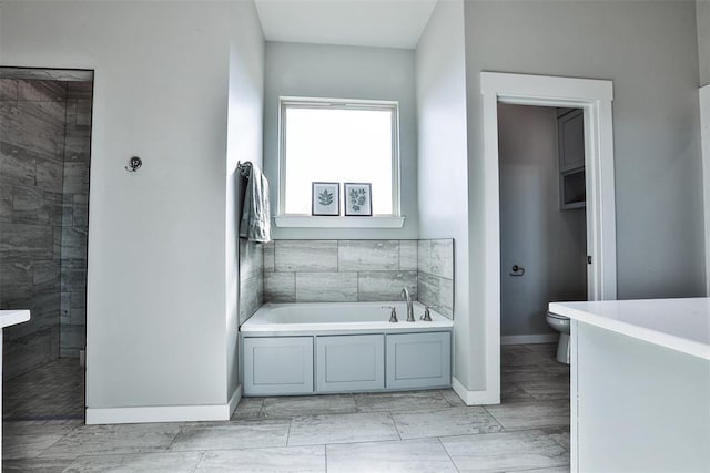 bathroom with a bathtub and toilet