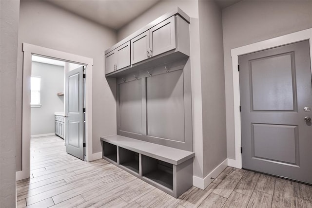 mudroom with light hardwood / wood-style flooring