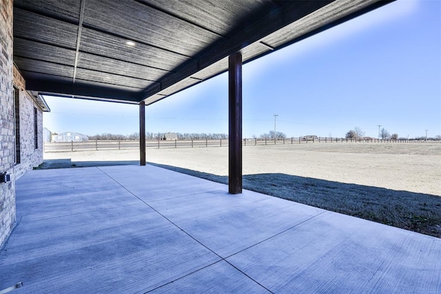 view of patio with a rural view