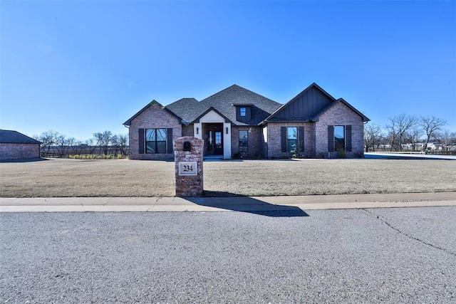 craftsman-style house with a front yard