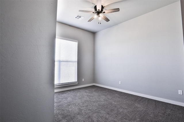 spare room featuring ceiling fan and carpet floors