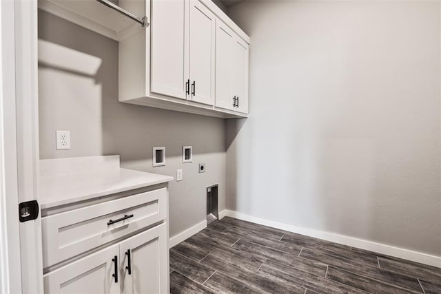 washroom with cabinets, washer hookup, dark hardwood / wood-style flooring, and electric dryer hookup