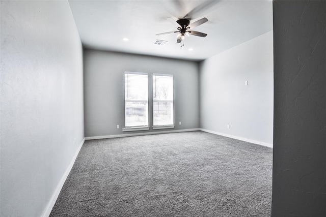 spare room with carpet flooring and ceiling fan