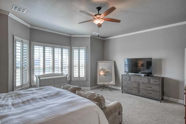 carpeted bedroom featuring ceiling fan and ornamental molding