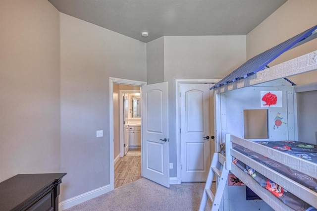 bedroom with light colored carpet