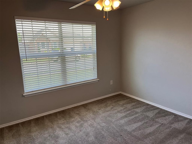 empty room with carpet flooring and ceiling fan