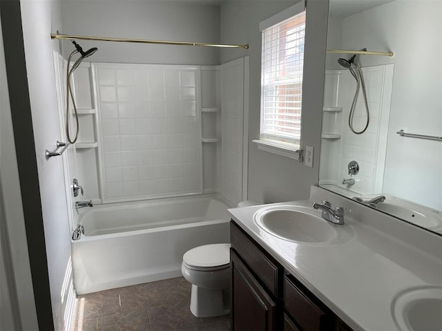 full bathroom featuring washtub / shower combination, tile patterned floors, vanity, and toilet