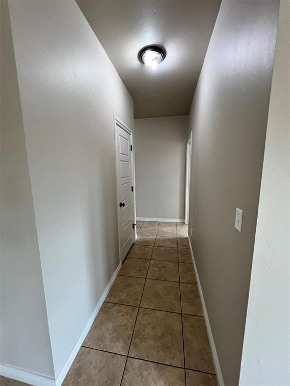 corridor with tile patterned floors