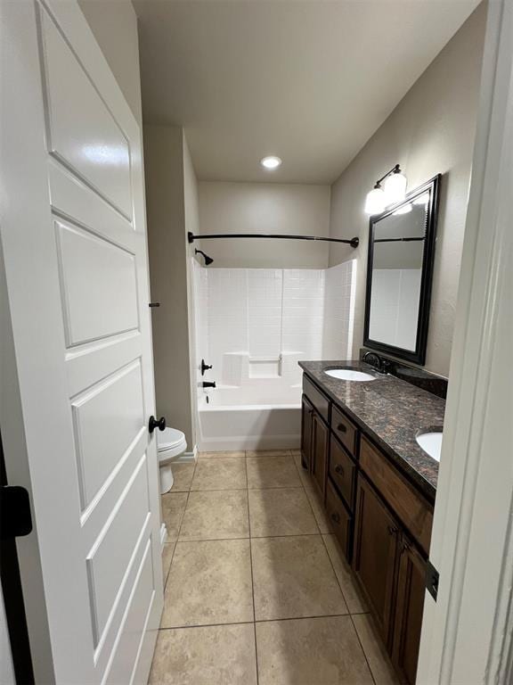 full bathroom featuring tile patterned floors, vanity, bathtub / shower combination, and toilet