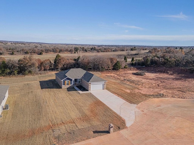 birds eye view of property featuring a rural view