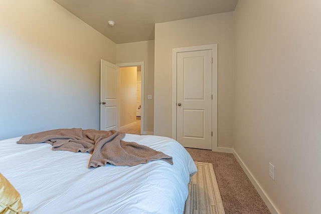 bedroom with light carpet