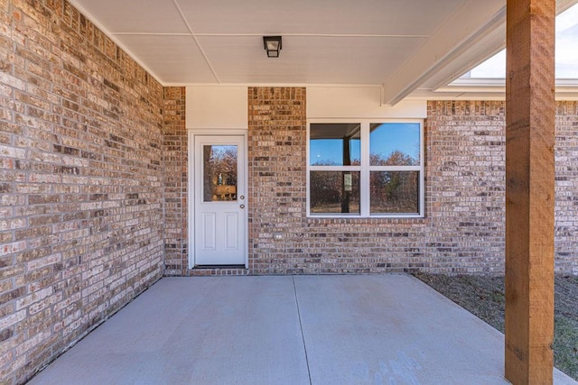 property entrance with a patio area