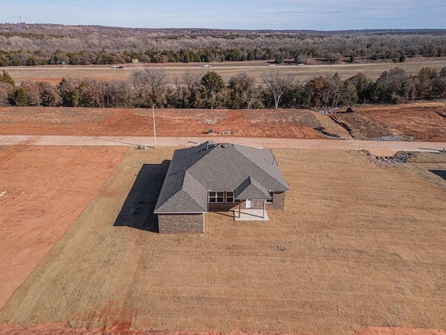 birds eye view of property with a rural view