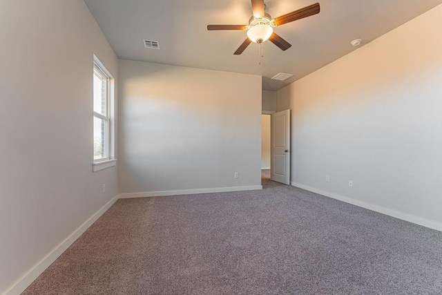 carpeted empty room with ceiling fan