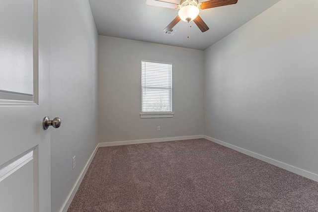 carpeted spare room with ceiling fan