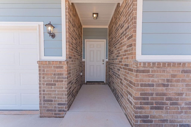 entrance to property featuring a garage