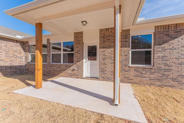 property entrance featuring a patio area