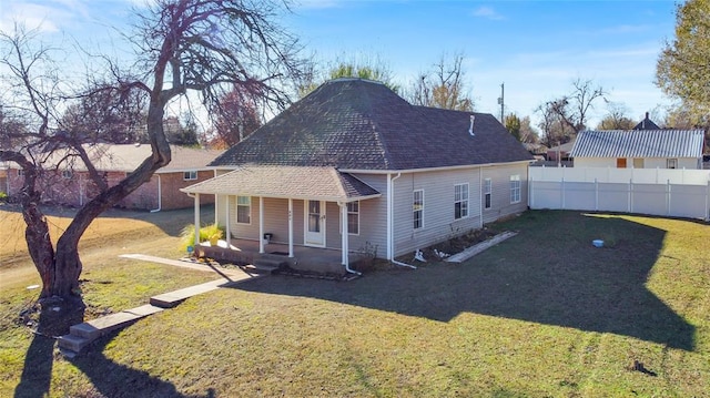 view of front of property with a porch and a front lawn