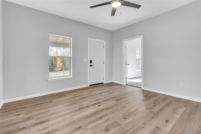 interior space with light hardwood / wood-style flooring and ceiling fan