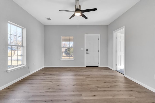 foyer entrance featuring light wood-type flooring and ceiling fan