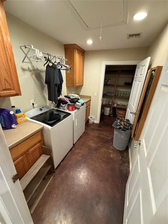 laundry area featuring cabinets and separate washer and dryer