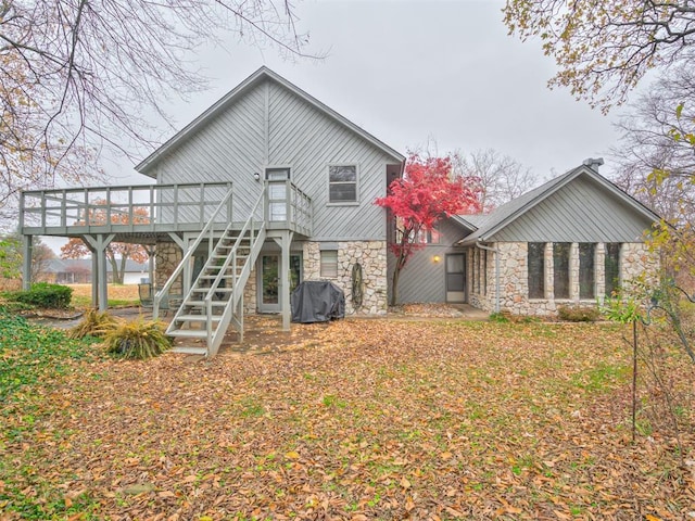 rear view of house with a wooden deck