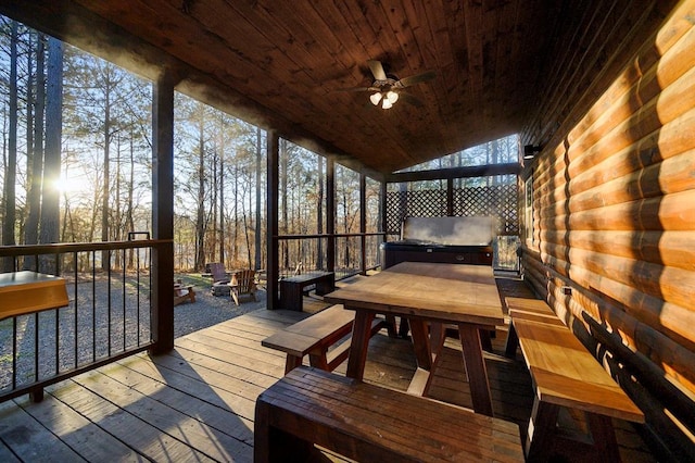 wooden deck featuring a grill, ceiling fan, and an outdoor fire pit